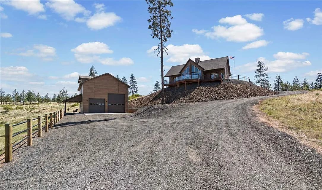 Custom home and matching shop on a rural hillside lot in the Inland Northwest